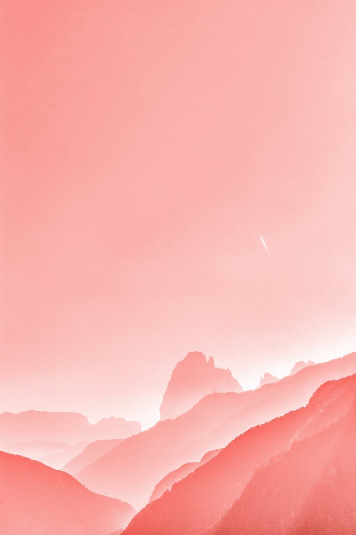 Beautiful serene mountain landscape in soft pastel pink, perfect for a minimalist and artistic touch.